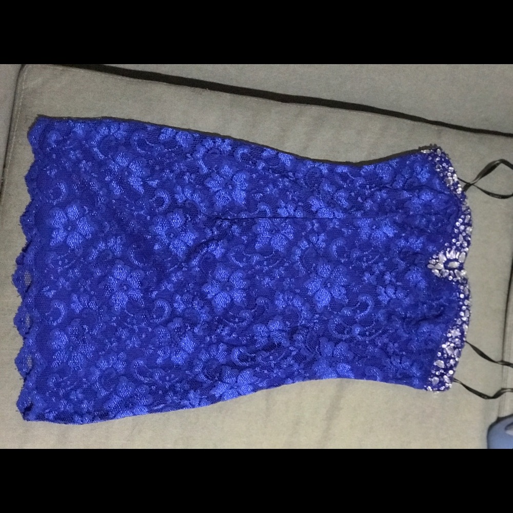 Bold lace electric blue mini dress .